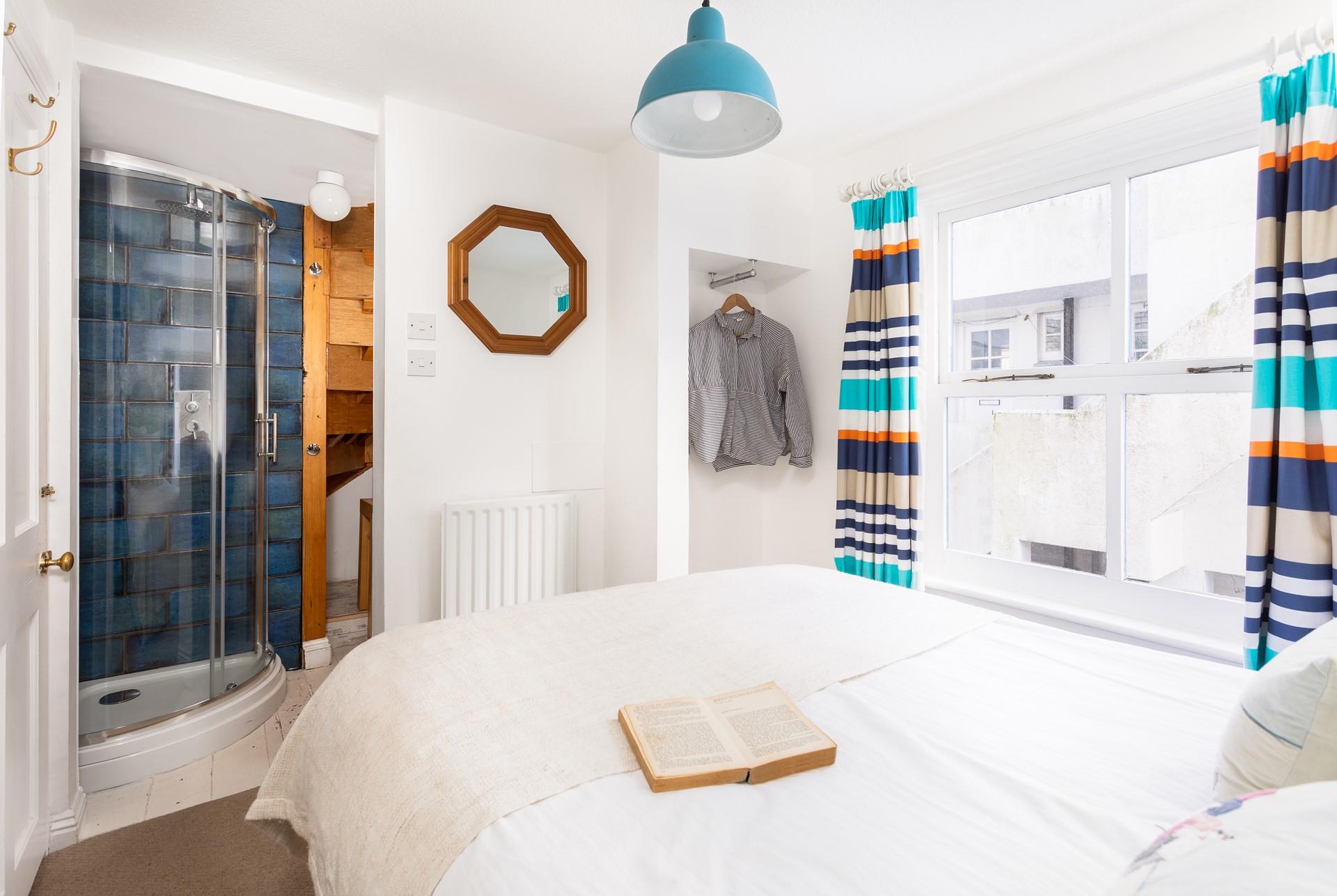 Drift away in crisp white bedding and wander into your en suite shower when you wake.