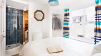 Drift away in crisp white bedding and wander into your en suite shower when you wake.