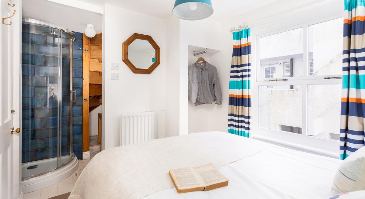 Drift away in crisp white bedding and wander into your en suite shower when you wake.