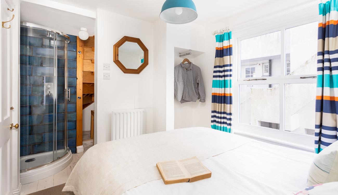 Drift away in crisp white bedding and wander into your en suite shower when you wake.