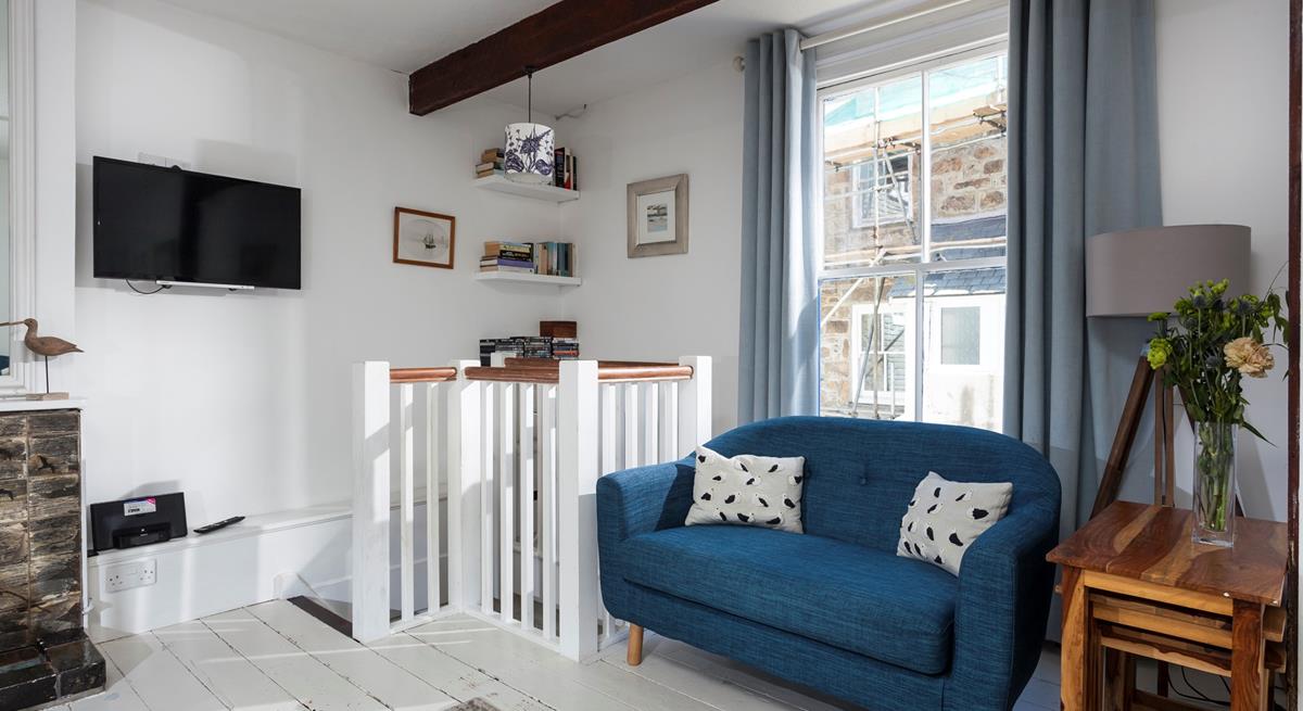 Put your feet up in the cosy sitting room after a busy day on the beach.