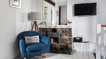 Put the fire on and snuggle up with something good on TV.