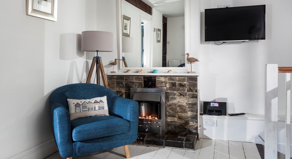 Put the fire on and snuggle up with something good on TV.