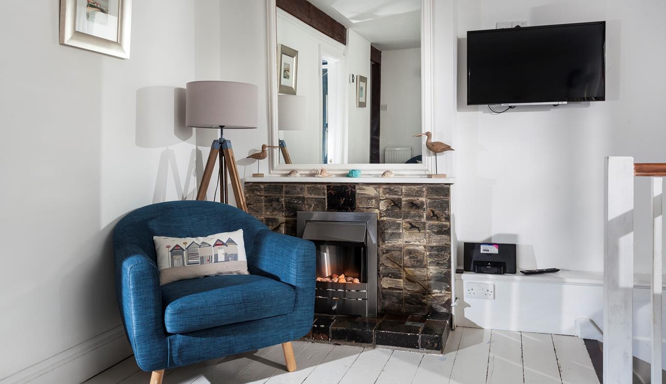 Put the fire on and snuggle up with something good on TV.