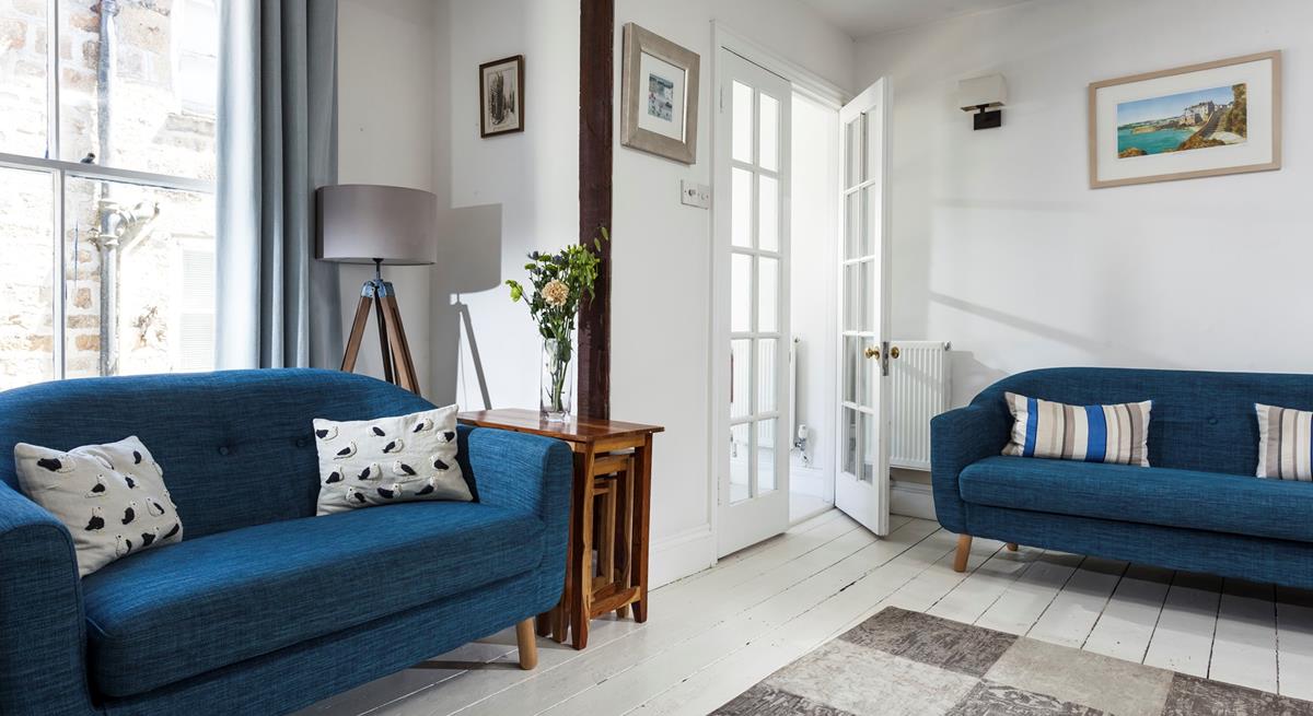The blue and white interiors create a calming atmosphere in your cosy sitting room.