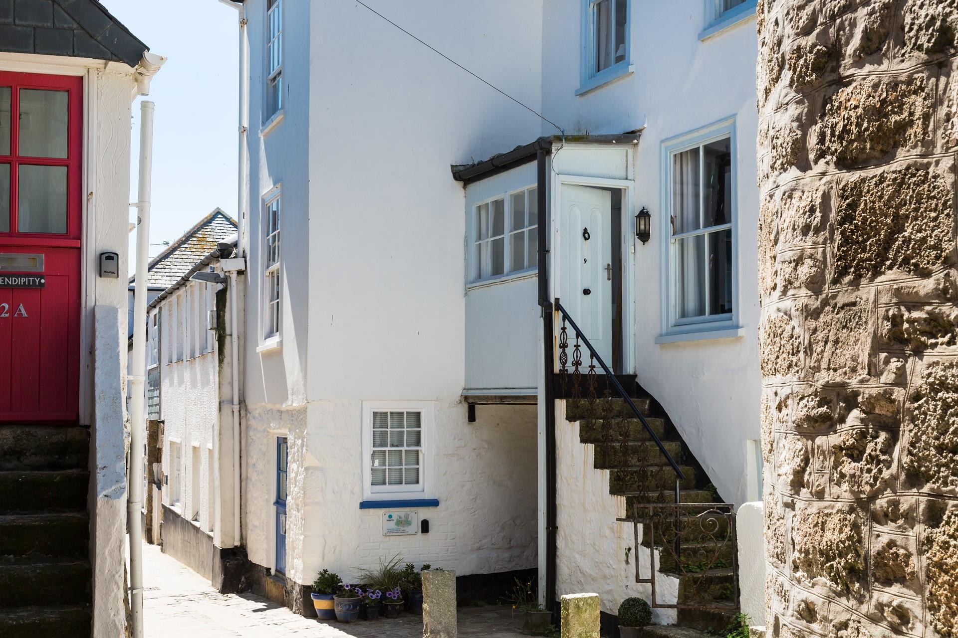 Granite steps lead up to the front door.