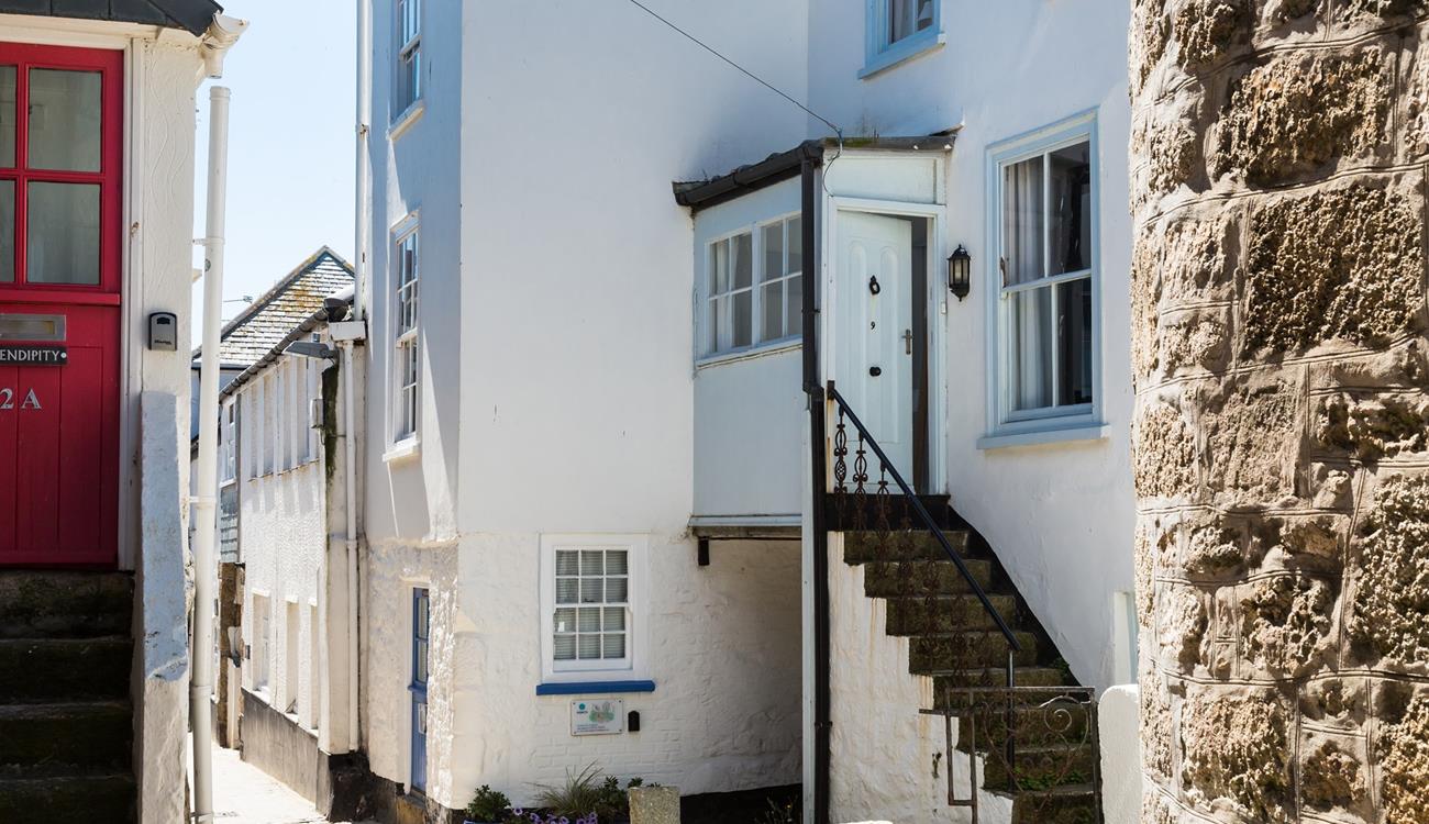 Granite steps lead up to the front door.