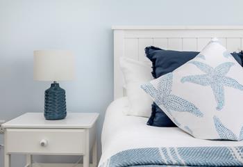 Shades of blue create a calming oasis in bedroom 1. 