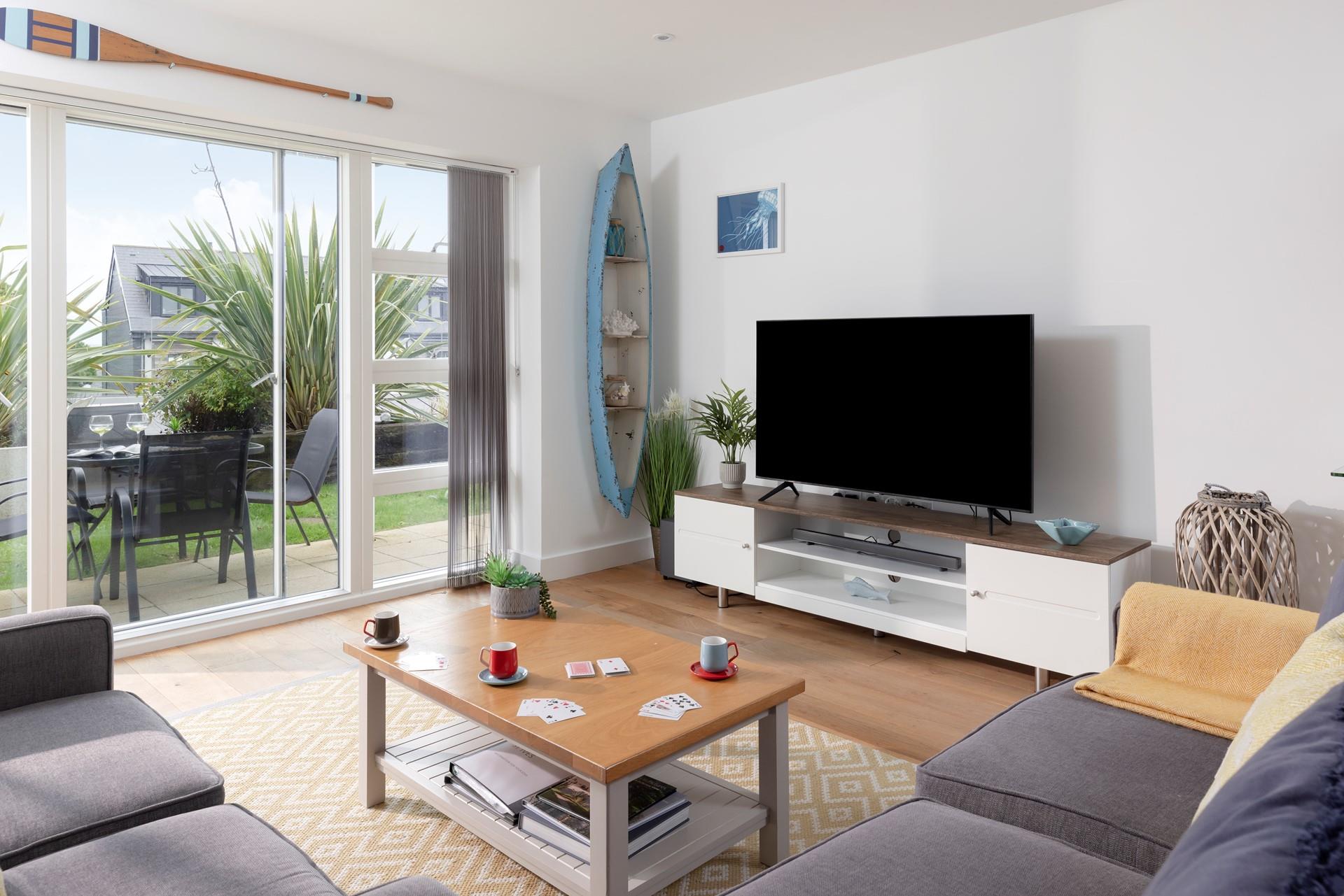 Bright and spacious, the living area is beautifully styled with coastal décor. 