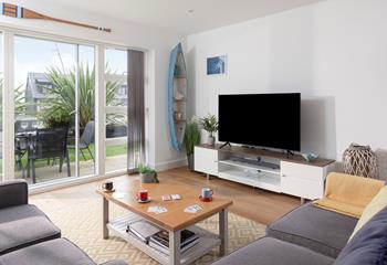 Bright and spacious, the living area is beautifully styled with coastal décor. 