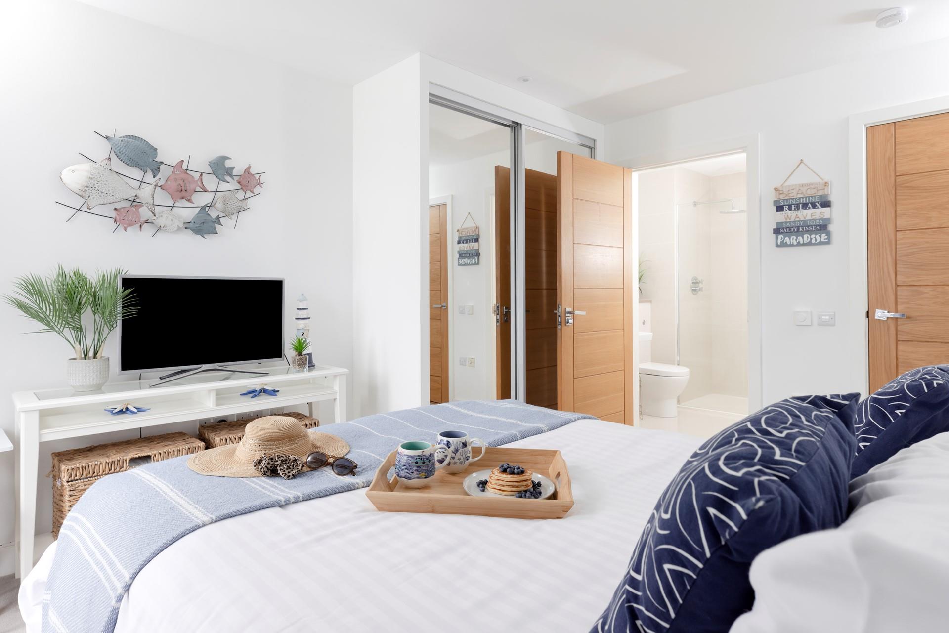 Shades of blue create a calming oasis in bedroom 1.