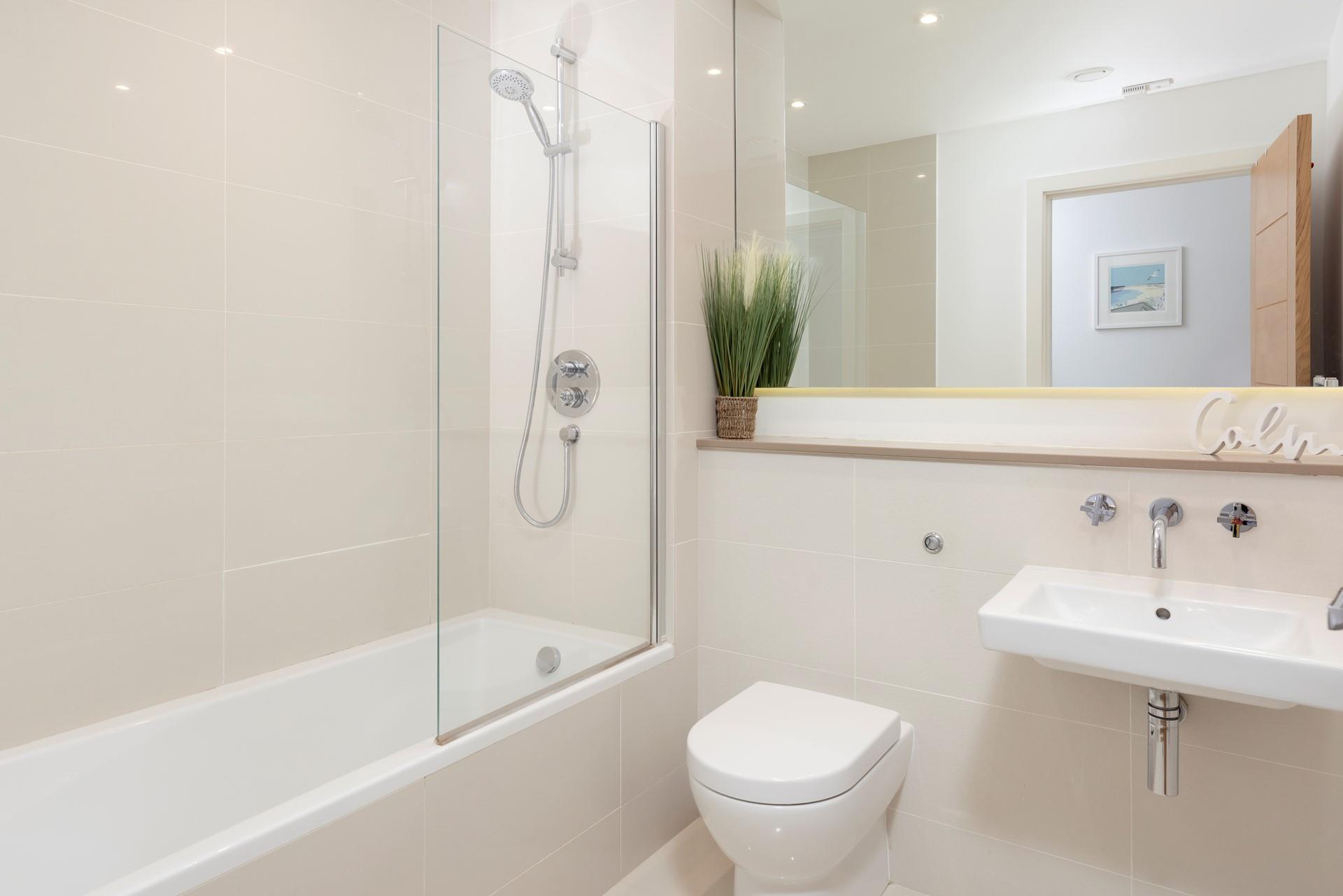 Sink into the bath in the family bathroom, enjoying a moment of calm.