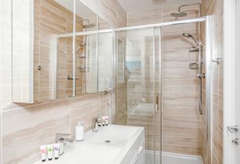 The en suite bathroom is stylishly designed, offering ample space to pamper yourself.