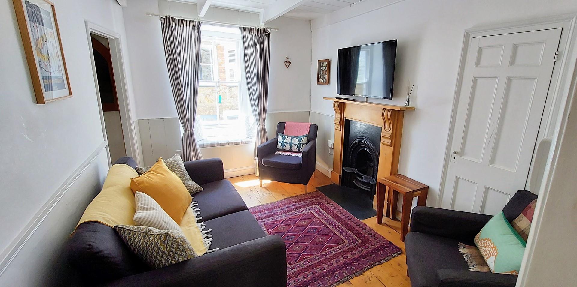 Settle in for a cosy evening in front of the TV after a long walk across the coast path.