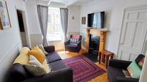 Settle in for a cosy evening in front of the TV after a long walk across the coast path.