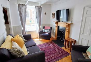 Settle in for a cosy evening in front of the TV after a long walk across the coast path.