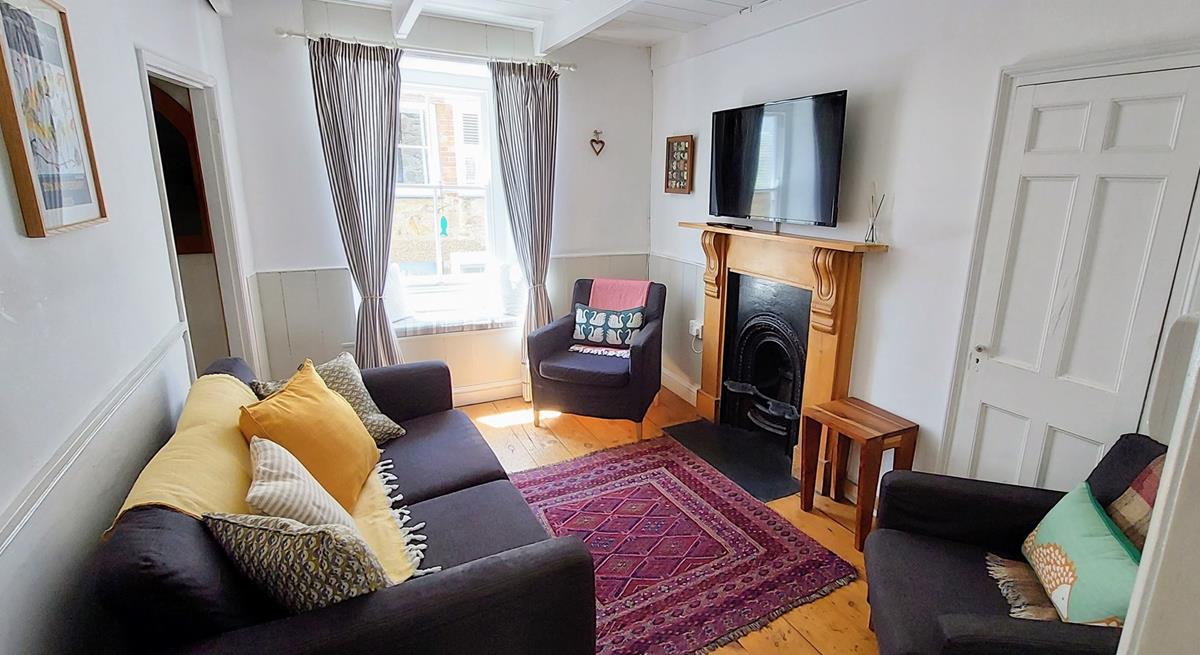 Settle in for a cosy evening in front of the TV after a long walk across the coast path.