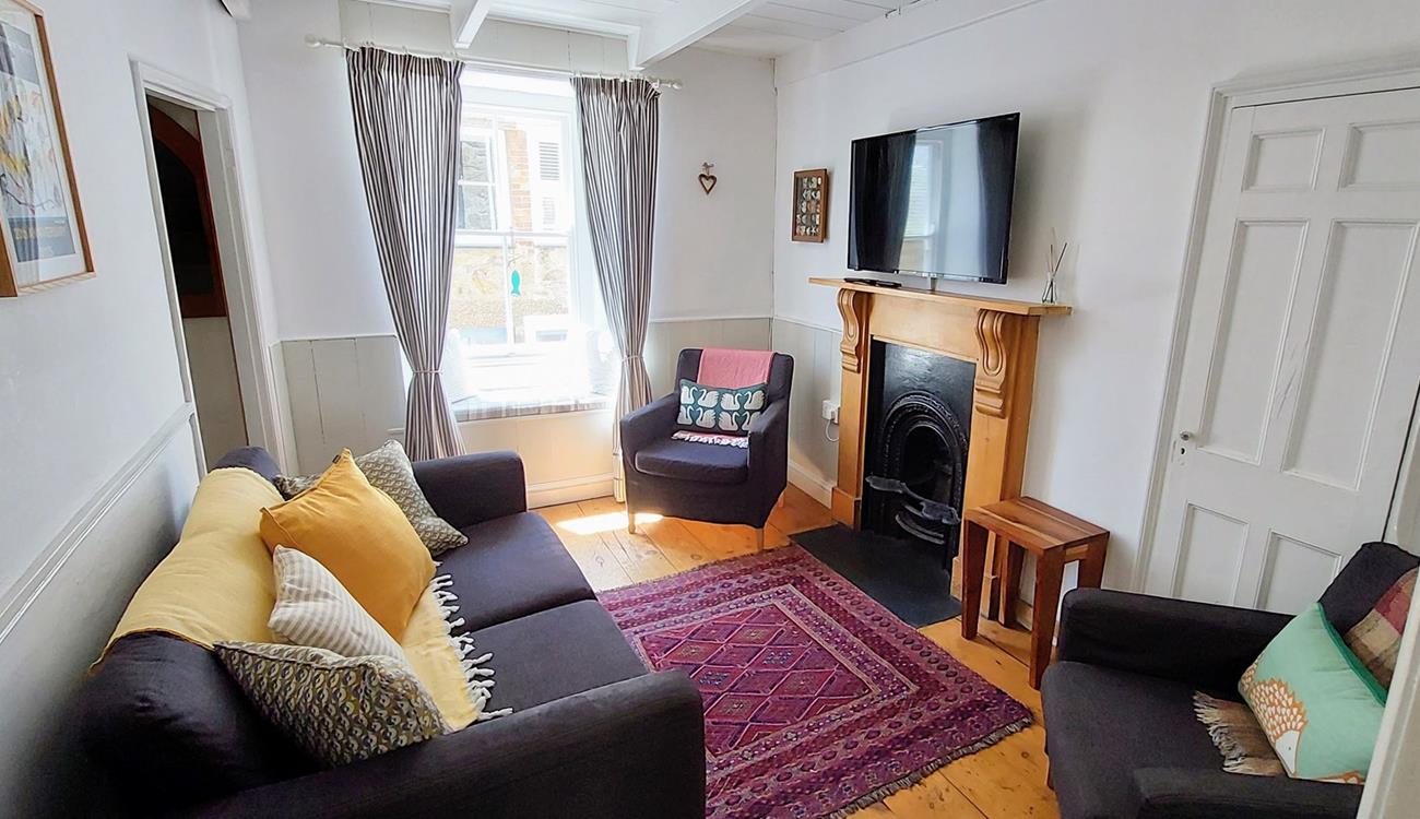 Settle in for a cosy evening in front of the TV after a long walk across the coast path.