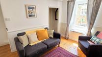 Unwind with a good book in the quaint window seat.