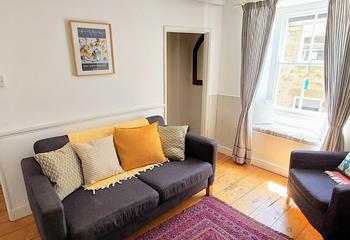 Unwind with a good book in the quaint window seat.