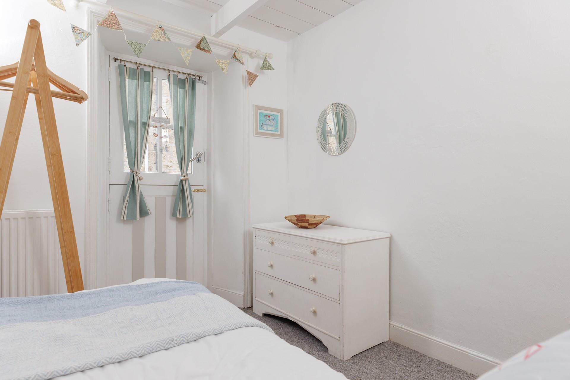 Calming coastal decor creates a relaxing bedroom.