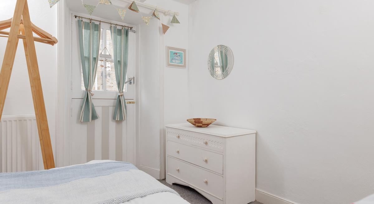 Calming coastal decor creates a relaxing bedroom.