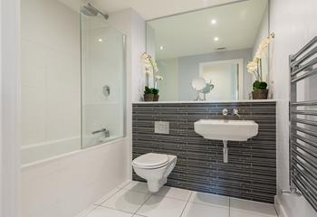 The spacious family bathroom is just the ticket for freshening up or running a relaxing bath at the end of the day.