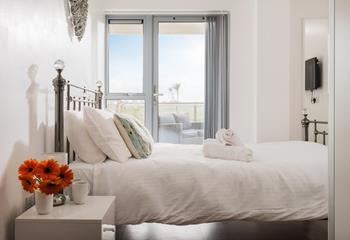 Bedroom 1 has doors that lead out onto the terrace so you can step straight out of bed to enjoy the view.