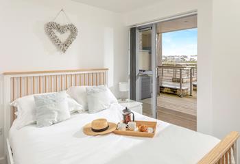 Bedroom 1 has doors that lead out onto the terrace so you can step straight out of bed to enjoy the view.