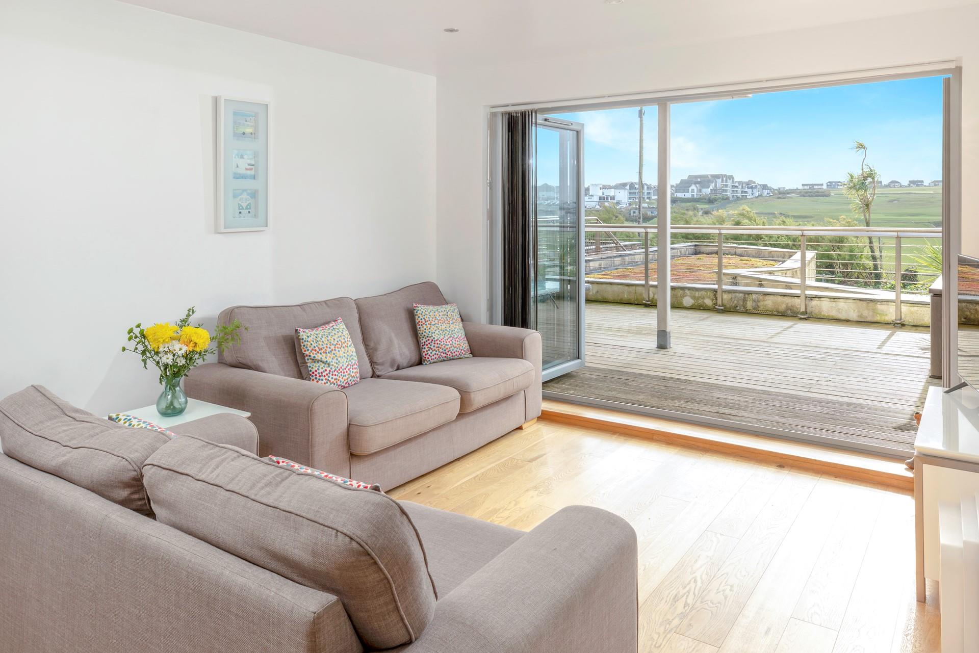 The open plan living area provides a comfortable space for relaxing after a day at the beach.