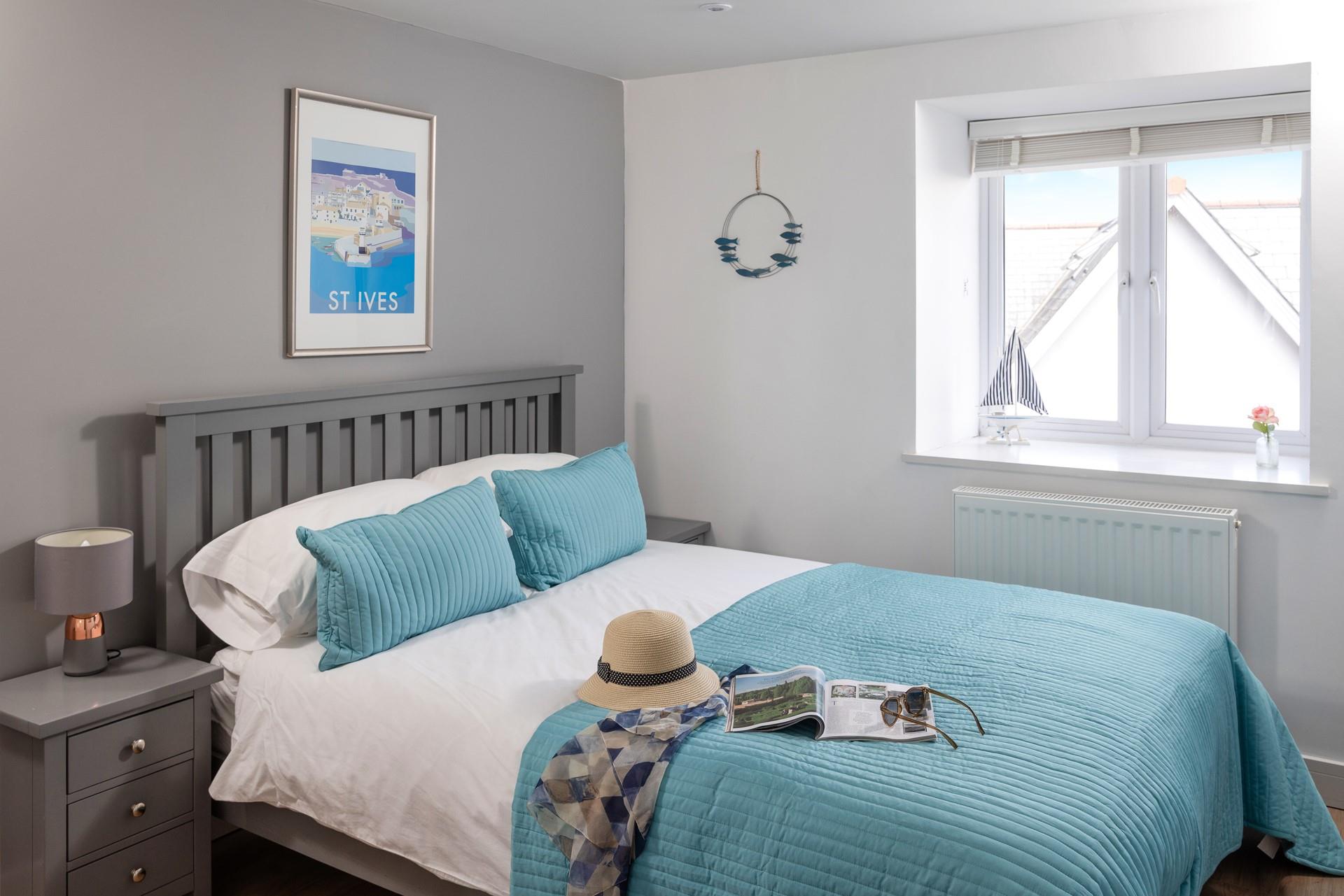 The spacious king size bed offers a dreamy night's slumber.