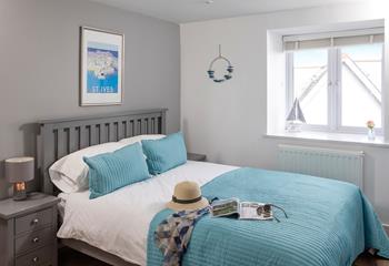 The spacious king size bed offers a dreamy night's slumber.