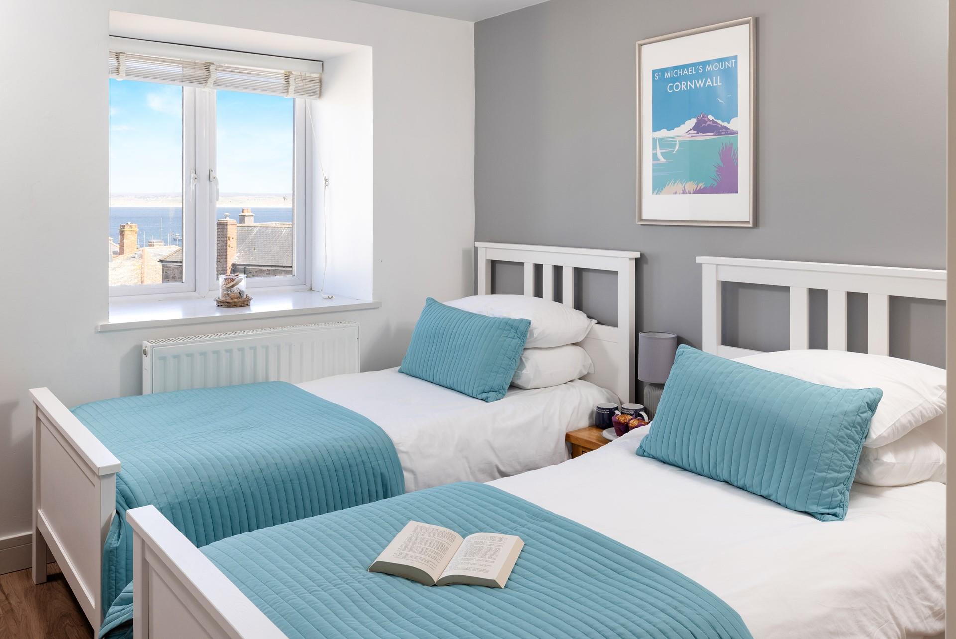 Wake up early and watch the sun rise over the sea.