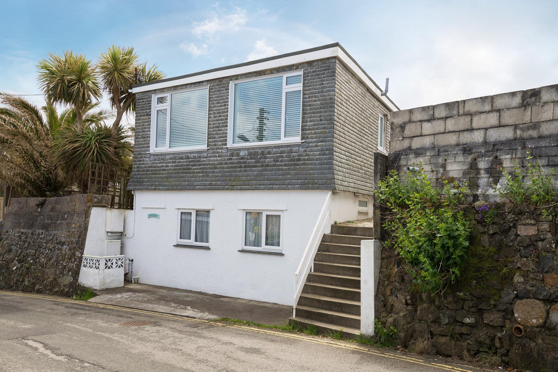 Located a short walk from the white sands of Porthmeor beach.