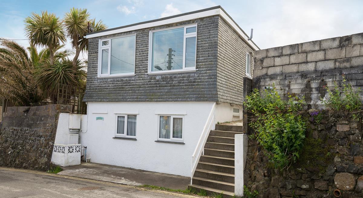 Located a short walk from the white sands of Porthmeor beach.