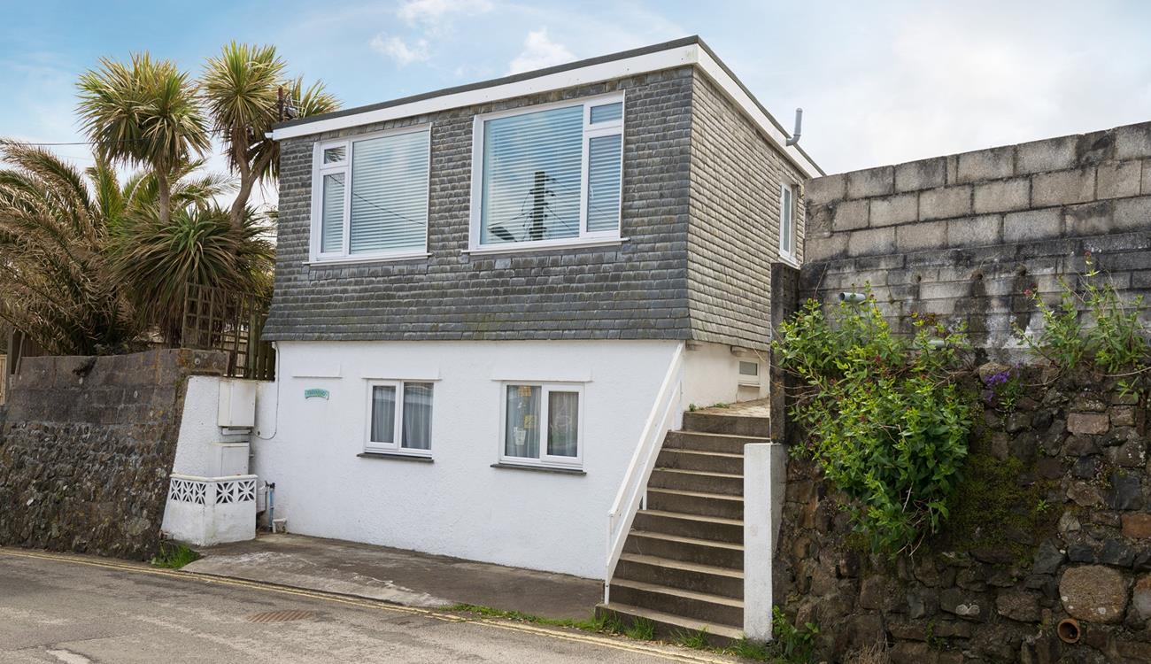 Located a short walk from the white sands of Porthmeor beach.