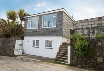 Located a short walk from the white sands of Porthmeor beach.