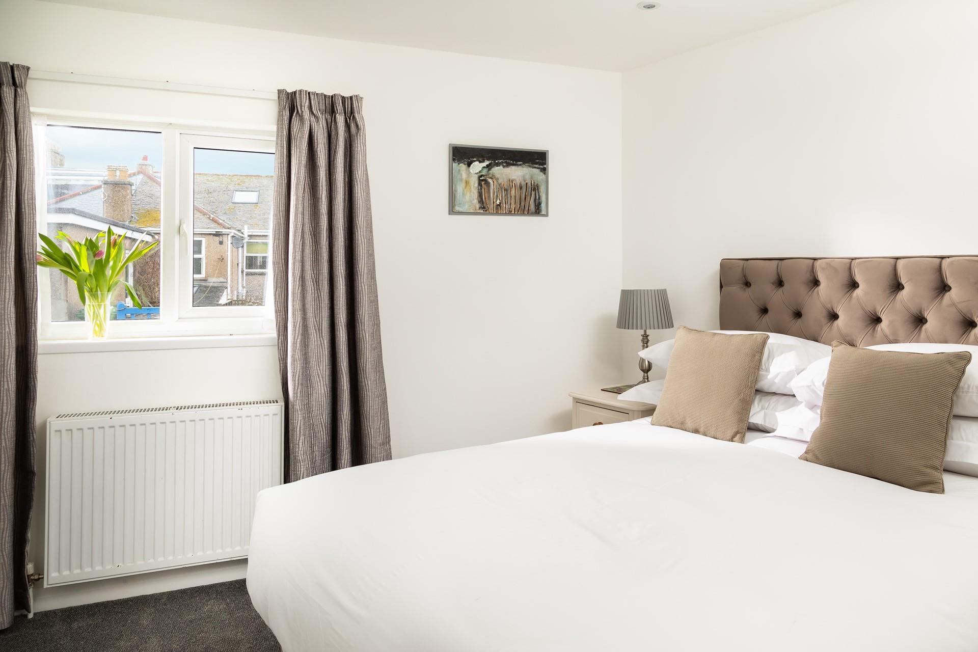 Snuggle into bed and drift off for a blissful night's sleep on the soft bed sheets.