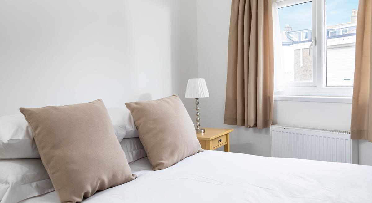 After spending the day relaxing on the beach, come back to snuggle into bed.