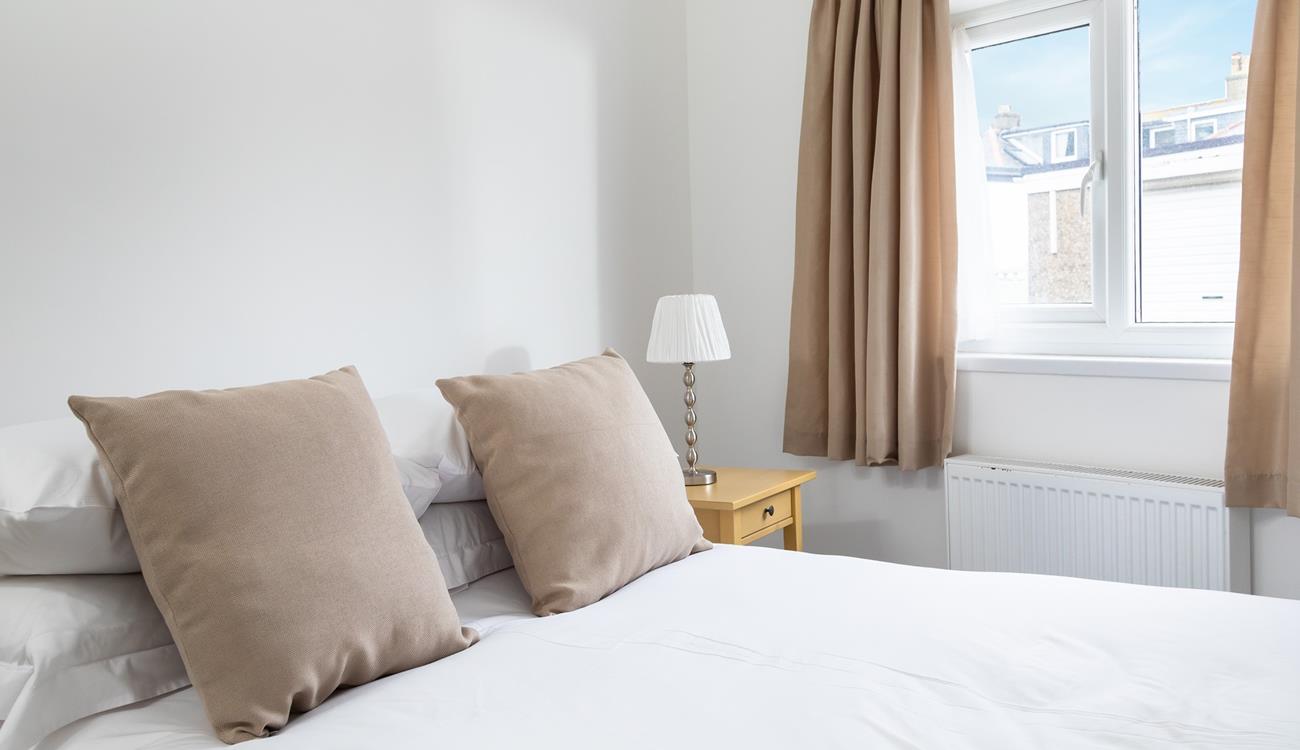 After spending the day relaxing on the beach, come back to snuggle into bed.