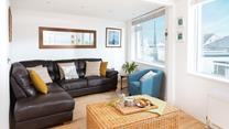 Modern and stylish the living space offers you a chance to relax after a day at the beach.