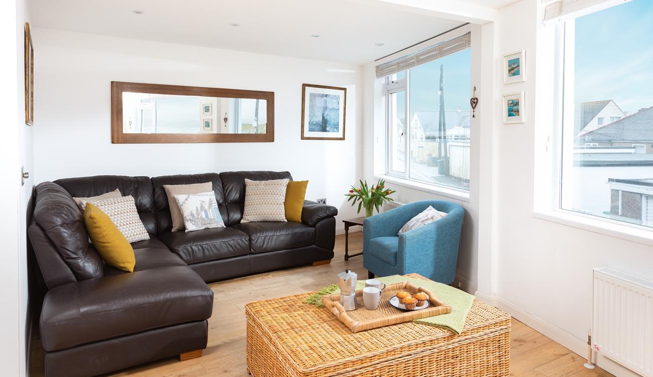 Modern and stylish the living space offers you a chance to relax after a day at the beach.