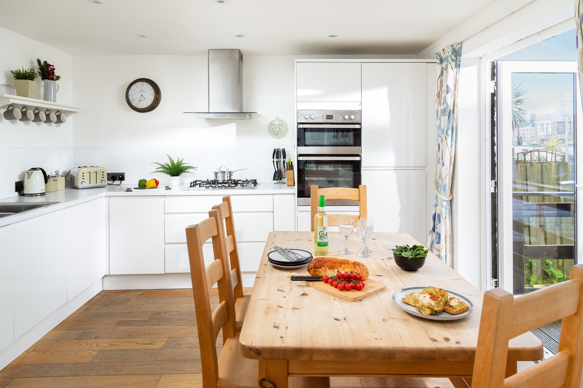 Sleek yet cosy the kitchen and dining space. 