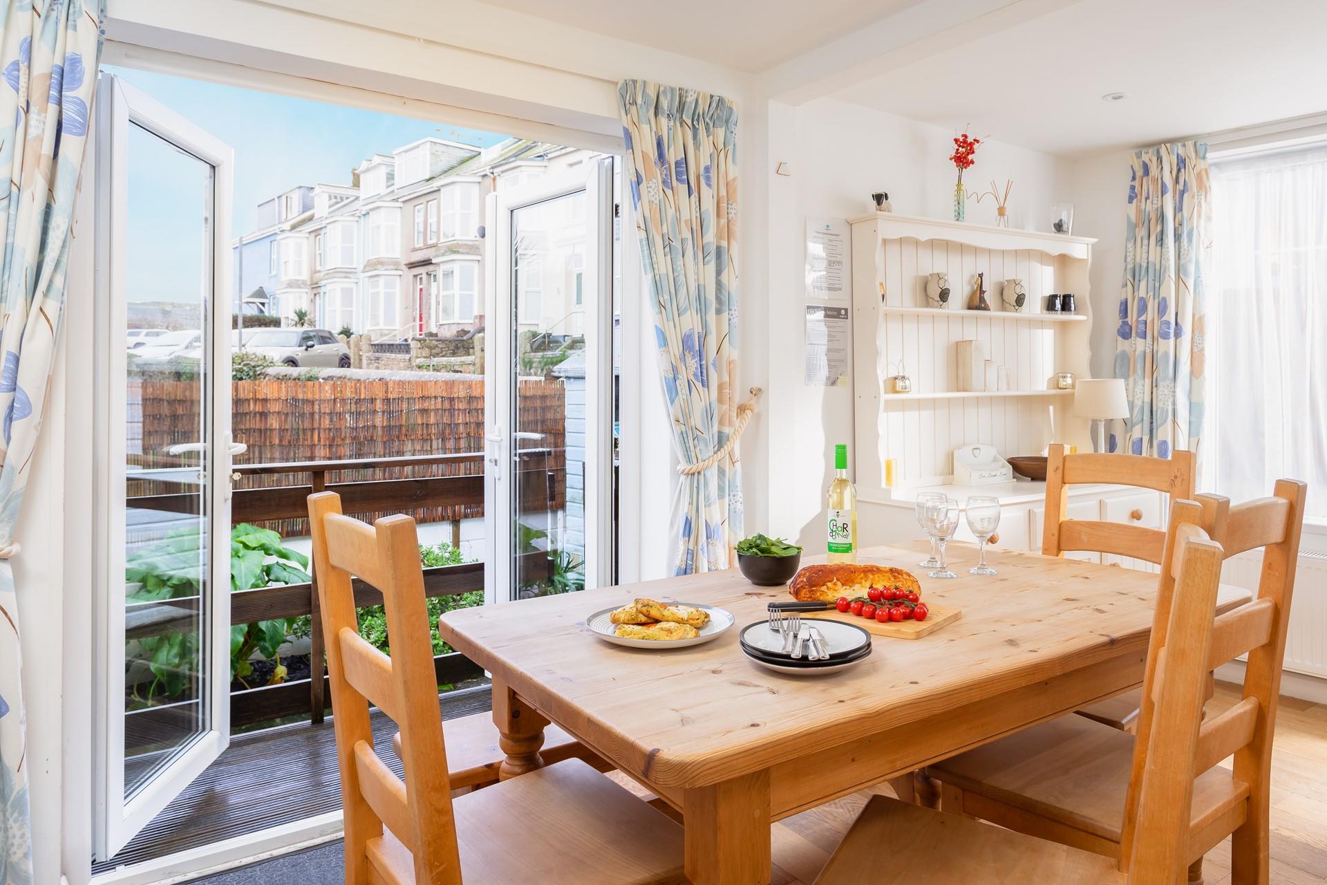 Enjoy tasty meals either around the table or out in the courtyard.