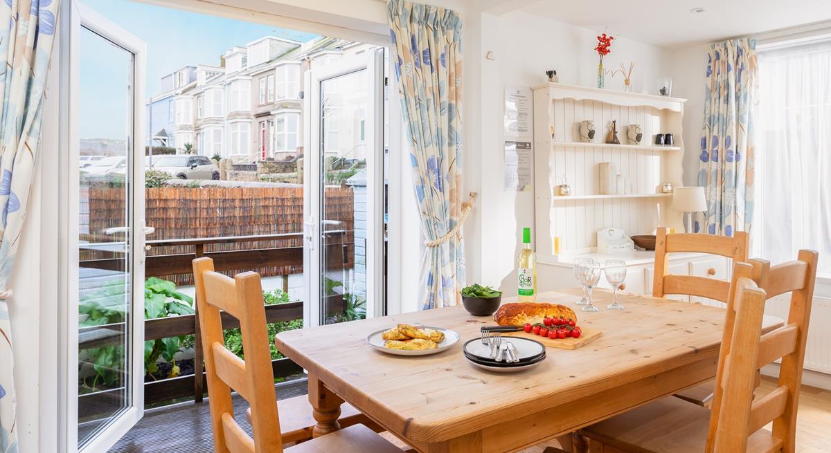 Enjoy tasty meals either around the table or out in the courtyard.