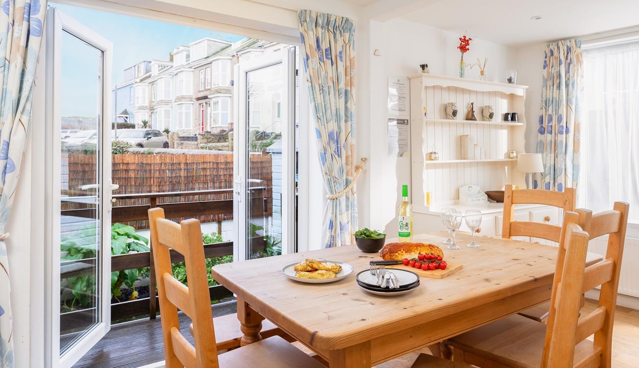 Enjoy tasty meals either around the table or out in the courtyard.