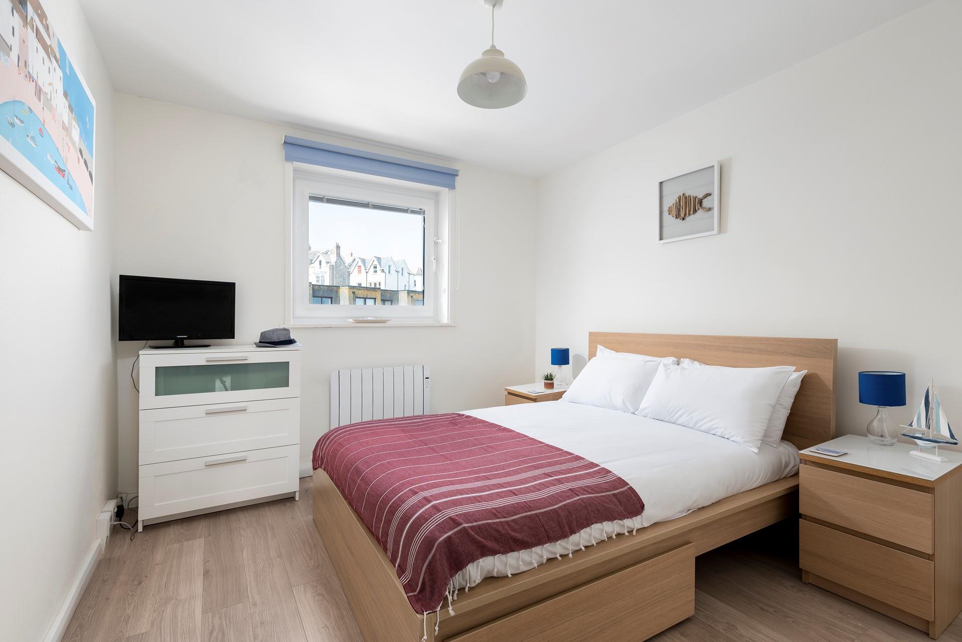 The spacious and comfortable king size bed promises a blissful night's sleep.