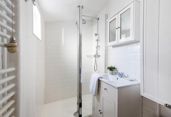 The bathroom benefits from a spacious double shower, perfect for washing away the sand after a day on the beach.
