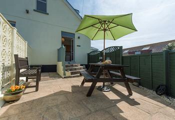 A private patio leads out to the courtyard, ideal for lunch al fresco!