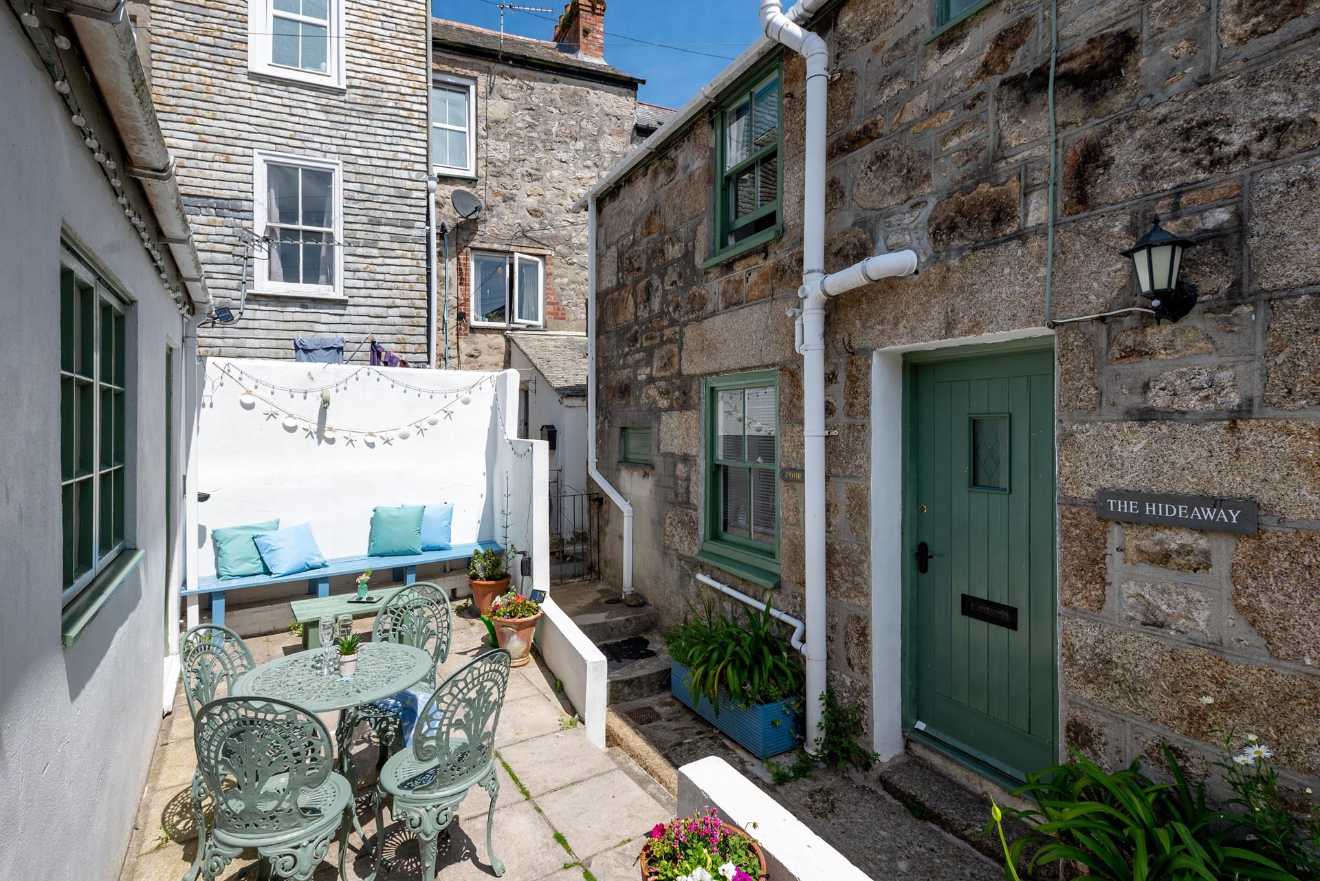 The outside space at the front of the property is perfect to enjoy a refreshing cool drink and snacks in the sunshine.